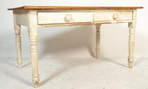 A large painted 19th Century Victorian pine farmhouse kitchen / dining table being raised on