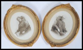 A pair of early 20th century portrait marital photographs of an Edwardian couple in gilt oval frames