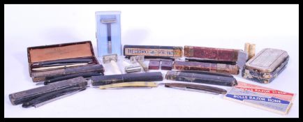A collection of vintage 20th century razors to include a selection of hollow ground German cut