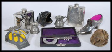 A mixed lot of vintage items to include Egyptian soapstone scarab, AA car badge, two hip flasks,
