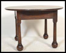 A good early 20th century oak coffee / occasional table raised on bulbous turned legs with ball