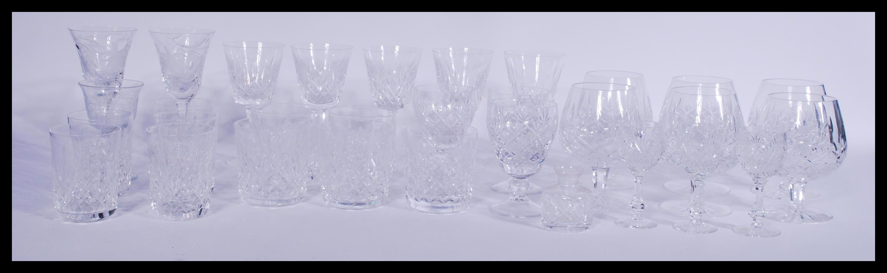 A collection of 20th Century  Waterford Crystal cut glass glasses with most being signed including