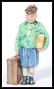 A Royal Doulton figurine entitled The Boy Evacuee HN3202. Limited edition 381/9500. measures:  21 cm