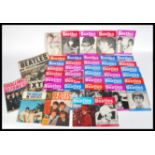 A collection of Beatles memorabilia to include The True Story of The Beatles 1964, The Beatles in