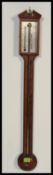 A vintage 20th century A Comitti and Son London mahogany inlaid stick barometer.