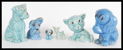 A collection on vintage 20th century SilvaC blue dog ceramics to include a blue Sad Sammy dog,