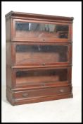 An early 20th Century Globe Wernick mahogany floor standing three sectional glazed lawyers bookcase,