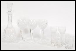 A 20th century Waterford crystal cut glass drinks service to include a tall decanter with a tall