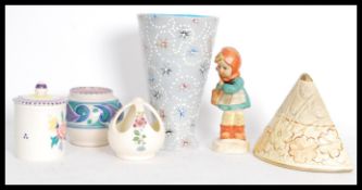 A group of pottery to include a 1930's Poole pot by Carter Stabler and Adams, rare 1950's Vulcan