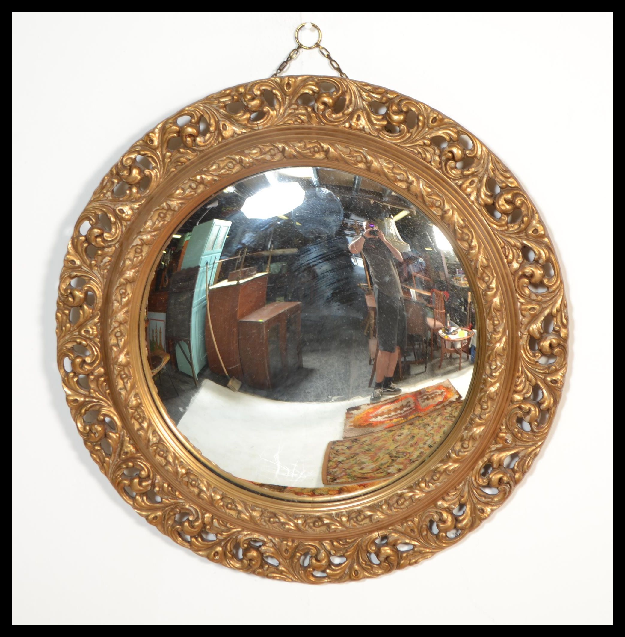 Two vintage 20th century comvex mirrors of circular form. One having a detailed ornate scrolled gilt - Image 2 of 3
