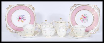 A 20th century Wedgwood s123 breakfast tea set in a chintz pattern comprising of two cups and