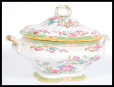 A 19th century Minton large tureen having a Chinese style floral pattern with twin shaped handles