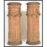 A pair of late 19th Century pedestal column plant / bust stands. Each pedestal heavily decorated