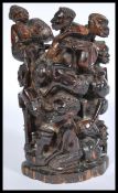 An African carved rose wood family tree of life sculpture, having many figures on a raised base