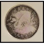 An early 20th century Chinese Dollar (Yuan) first year / starting year coin featuring Yuan Shikai as