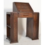 A 1930's Art Deco oak bureau desk having a central  kneehole recess with fall front cover with fully