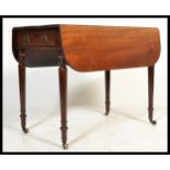 A 19th century Victorian Pembroke mahogany double drop leaf side dining table raised on turned