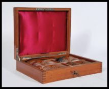A early 20th Century opticians eye test lenses by Pettie & Whitelaw within a mahogany case, with a