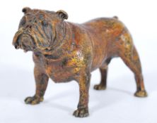 An Austrian cold painted bronze figure of a bulldog standing four square, with applied roundel