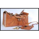 A pair of leather African carry bag by Chui with a fabric lining and leather stitching detail and