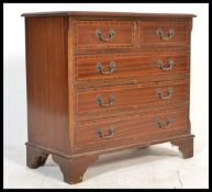A contemporary Regency revival two over three mahogany bachelors chest of drawers with fitted swag