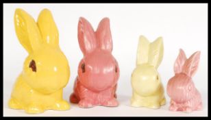 A collection of vintage 20th century SylvaC rabbit figurines to include a rare yellow gloss rabbit