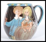 A vintage 20th Century Scandinavian motto ware style jug, decorated with a young couple in bridal