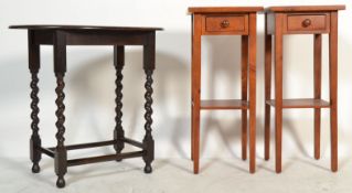 A pair of 20th Century fruitwood tall bedside tables, raised on square tapering supports with a