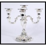 A vintage 20th century WMF silver plated five point candelabra having scrolled branch arms.