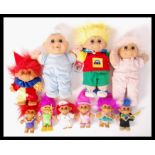 A good collection of vintage retro Troll dolls to include four larger examples and six smaller