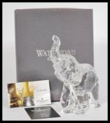 A 20th century Waterford crystal cut glass crystal figurine of an elephant with a raised trunk