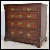 A Georgian George III oak Lancashire / North Country cross banded chest of drawers, two short