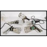 A group of five vintage retro 20th century industrial inspection - cage trouble lamps with clamp