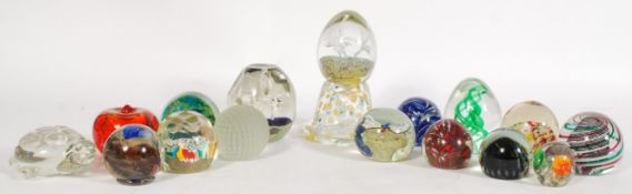 A collection of glass desk paperweights including some examples of Millefiori, swirl design,