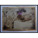 A vintage early 20th century photograph on glass depicting The Well at Carisbrooke castle with man