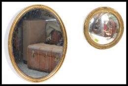 Two vintage early 20th Century gilt framed mirrors to include a circular fish eye mirror together