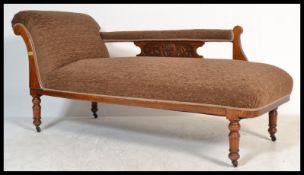 A 19th Century mahogany framed single scroll end Victorian chaise longue with carved design back,