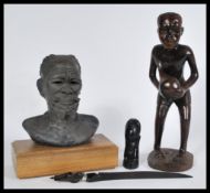 A group of vintage 20th century carved African wares to include a carved Zulu bust and other