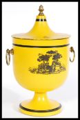 A 20th century vintage retro yellow and black lidded ice bucket with round brass swing handles,