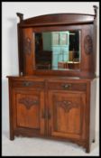 A late 19th Century / early 20th Century mahogany Art Nouveau mirror back buffet sideboard, carved