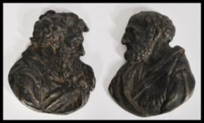 Two 19th century lead / metal bust plaques of Greek philosophers Plato and Aristotle facing toward