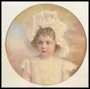 A 20th century mixed media Tondo artwork on board of a young girl, signed P Muller to the corner