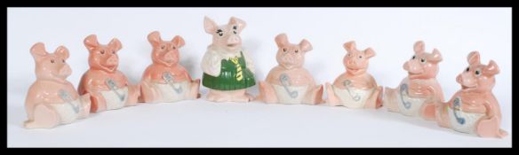 A group of vintage retro Natwest advertising ceramic piggy banks from the Natwest Pigs series.