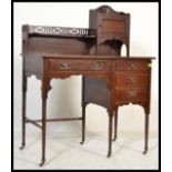 A small late Victorian mahogany ladies writing desk, single bank of three drawers, with raised