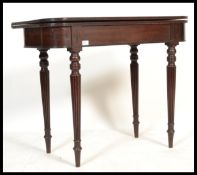 An 18th century George III mahogany tea table bein