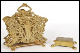 A late 19th Century Victorian scroll work letter rack together with a brass stamp box of similar