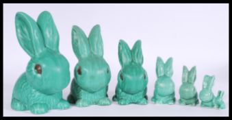 A selection of vintage 20th century SylvaC green rabbit figurines with stamped numbers 1028, 1027,