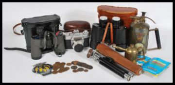 A collection of vintage items to include a Vivo tripod with case, an AA car badge, a Voighander