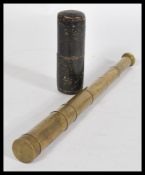 A 19th century brass small five draw pocket telescope with its original leather box and brass lens