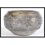 An early 20th century, possibly Lucknow, Indian bowl depicting embossed hunting scene with lions,